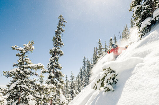 Skier at Monarch Mountain resort skiing powder