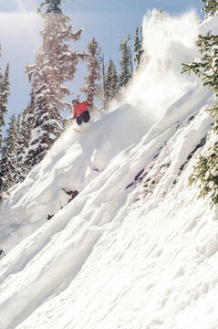 Skier at Monarch Mountain resort skiing powder