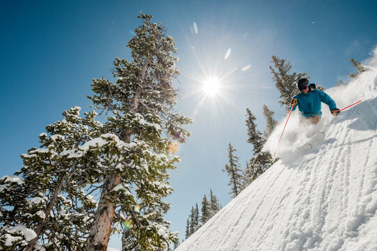 Skier at Monarch Mountain resort skiing powder