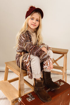 Portrait of a beautiful smiling 7 years old girl. Close-up, studio.