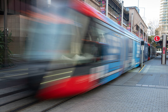 Light rail moving past at Circular Quay, Sydney shot with a long exposure