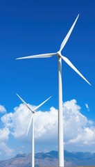 Wind turbines in a clear blue sky, symbolizing renewable energy and sustainability.