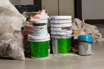 Busy and Cluttered Workspace with Painting Supplies Everywhere