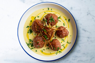 Fried meatballs with curry sauce. Top view table with  decoration.