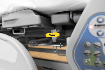 Emergency life support intervention button at the patient bed. Hospital bed with CPR guidance. emergency response button for hospitalized patient.