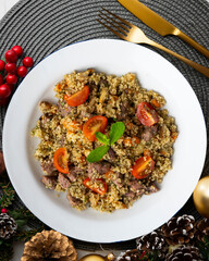 Couscous with beef and vegetables. Top view table with Christmas decoration.