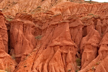 Northern Kyrgyzstan. The unusual texture of red-yellow clay rocks in the famous Skazka Canyon, off the coast of Lake Issyk-Kul.