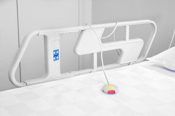 Nurse call button in patient room in modern hospital. Hand pushing nurse call button. patient press red emergency button to calling nurse for help in hospital