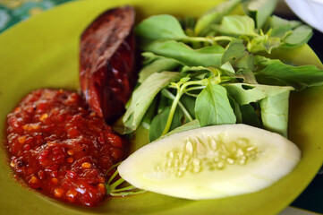 Lalapan (Indonesian raw vegetable salads) served with Sambal.