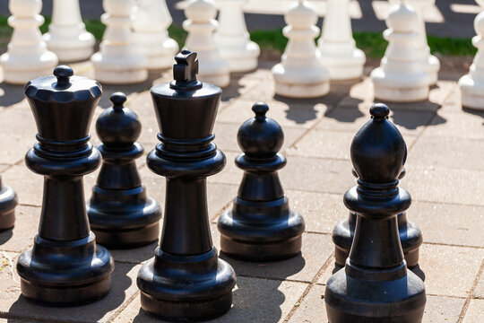 Giant chess game in sunlight ready to play