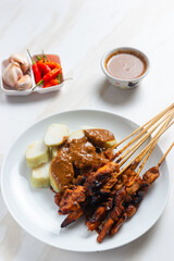Sate ayam or Satay Ayam is Indonesian food and cuisine of seasoned, skewered and grilled chicken with wooden skewers. Perfect for recipe, article, catalogue, commercial, or any cooking content.