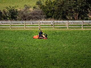 Ride On Mower In Large Overgrown Paddock