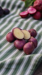organic potatoes close up on striped tablecloth selective focus