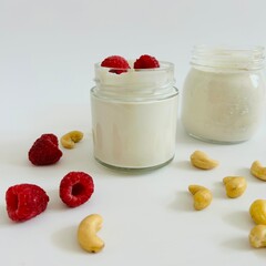 Cashew Creamy Yoghurt in Glass Jar with Raspberry