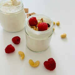 Cashew Creamy Yoghurt in Glass Jar with Raspberry
