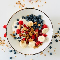 Bowl with Berry, Banana, Yogurt and Granola for Breakfast