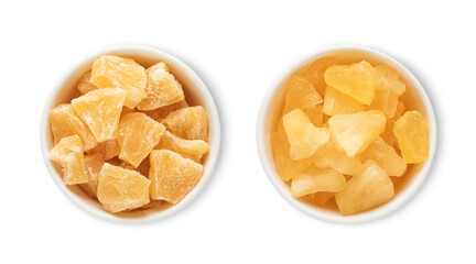 Bowl plates with sweet dried and soft pineapple pieces isolated on white background.Top view.