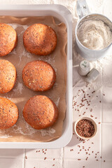 Homemade and tasty flax seed buns freshly baked in bakery.
