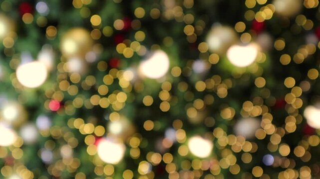 Abstract christmas holiday with festive gold bokeh light on tree blurred background