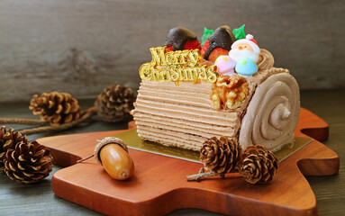 Christmas Yule Log Cake with Natural Dried Pinecones and Oak Nut