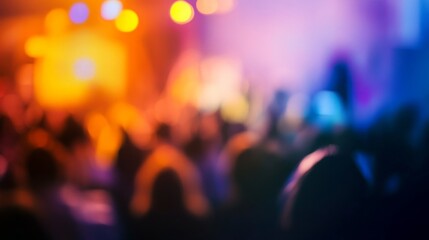 A blurred image of a crowd enjoying a concert, captured in a haze of colorful lights.