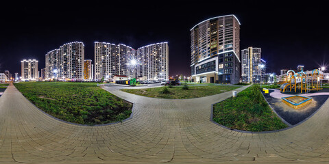 night panorama 360 near skyscraper multistory buildings with illumination of residential quarter...