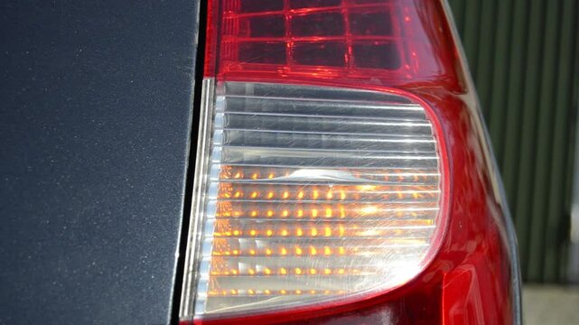 Close-up car with flashing side signal.Selective focus.