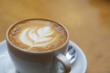 Close-up of a cappuccino coffee on a table in a cafe