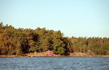 red woodhouse at the sea  in autumn, nacka,sverige,sweden,mats,stockholm,summer
