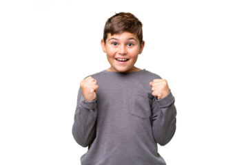 Little caucasian kid over isolated chroma key background celebrating a victory in winner position