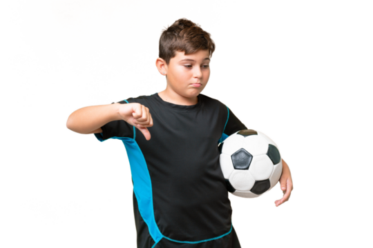 Little caucasian football player kid over isolated chroma key background showing thumb down with negative expression
