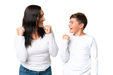 Little caucasian kid over isolated chroma key background celebrating a victory