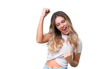 Young Uruguayan woman over isolated background celebrating a victory