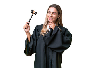 Judge Uruguayan woman over isolated background looking to the side and smiling