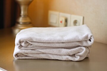 Stack of white towels on table