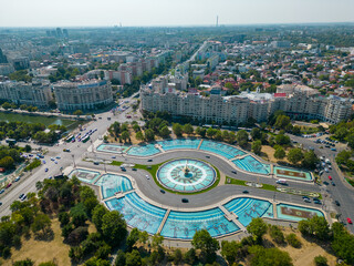 Aerial Drone point of view of Unirii Water Fountains. Situated in the city center of Bucharest is...