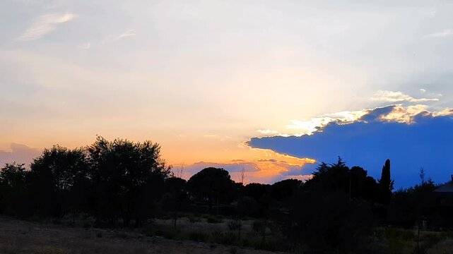 sunset clouds pareidolia over the mountains