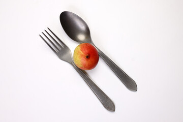 Green yellow red ripe mini pear sweet juicy on white background basket fork