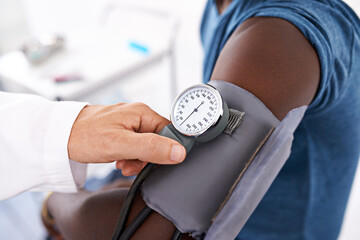 Hands, doctor and check for blood pressure at hospital with sphygmomanometer, hypertension or heart...