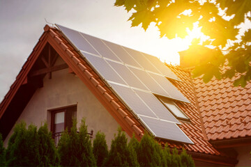 Solar power energy on the roof to a standard house. Solar power panels ,Photovoltaic modules for...