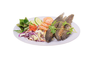 a plate of crispy fried loach accompanied by fresh vegetables, presenting an appealing and colorful meal setup. The dish looks delicious and well-prepared, perfect for a hearty meal.