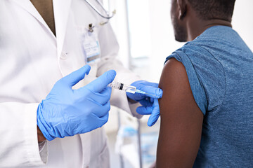 Obraz premium Doctor, injection and arm in hospital for vaccine, healthcare and medicine administration with antibiotics. Gp, needle and patient in clinic for virus immunity, diabetes or wellness with insulin shot