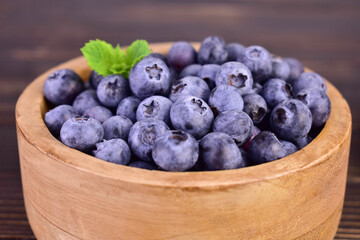 Blueberries in a wooden bowl. Close-up.
