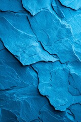 Naklejka premium A tight shot of a blue wall, adorned with a rocky texture pattern along its edge, and a plane distinctly etched in its center