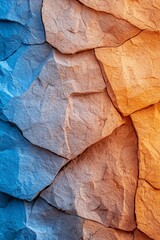 Naklejka premium A tight shot of a rock wall, adorned with blues, yellows, and oranges painted on its facets In the heart of the wall, a beaming light gl