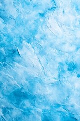 Obraz premium A tight shot of a blue-tinted ice chunk with white streaks, suggesting melting