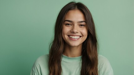 Fototapeta premium teenage american woman on pastel green background model close-up smiling with beautiful teeth for ad concept space for text