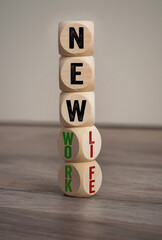 Cubes, dice or blocks on wooden background with word New life and new work