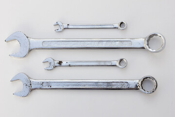 Open-Ended Wrench: A wrench with jaws having a fixed width of opening at one or both ends of the handle.