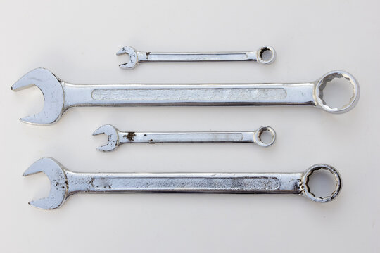 Open-Ended Wrench: A wrench with jaws having a fixed width of opening at one or both ends of the handle.